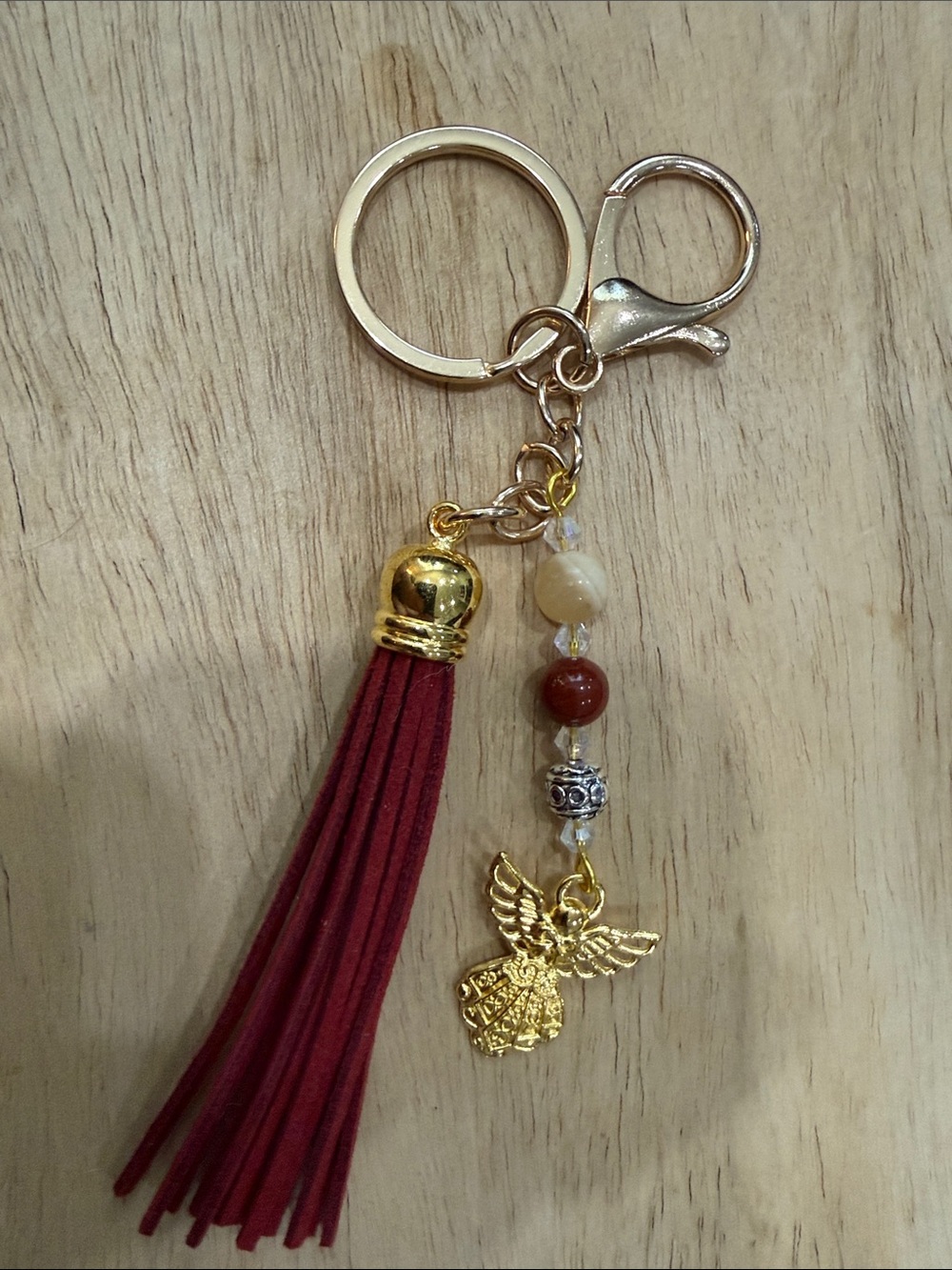 Gold Angel Charm Keychain with Burgundy Tassel and Bead Accents